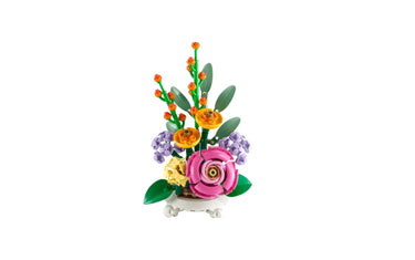 Colorful LEGO flower bouquet with pink, yellow, orange, and purple blooms on white vase