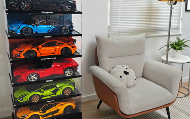LEGO Technic display cases showcasing a collection of supercars