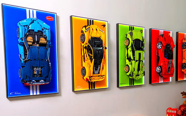 LEGO Technic cars displayed on a wall with custom display frames