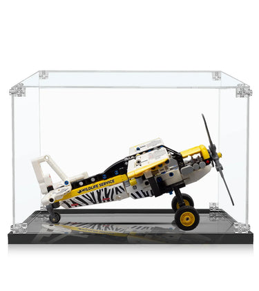 Miniature LEGO-style wildlife service propeller airplane model in clear display case
