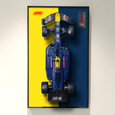Top view of a LEGO Formula 1 race car model mounted on a split yellow and dark blue background