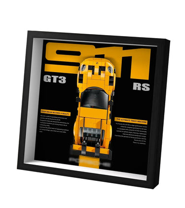 Framed LEGO model of yellow Porsche 911 GT3 RS on black background with text highlights