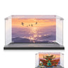 Clear display case with sunset ocean backdrop featuring flying birds, shown with Lego pirate ship inside