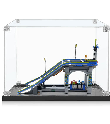 Miniature LEGO skate park with ramps, railings, lights, and small accessories inside a clear display case