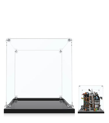 Clear acrylic display cases with black bases, one empty and one showcasing a detailed LEGO haunted mansion