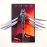 3D LEGO model of a sandworm with extended fins mounted on a Dune-themed desert sunset poster