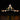 Illuminated model of NASA Space Shuttle Orbiter Enterprise mounted on Boeing Shuttle Carrier aircraft against black background