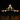 Illuminated model of NASA Space Shuttle Orbiter Enterprise mounted on Boeing Shuttle Carrier aircraft against black background