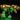 Illuminated LEGO Tyrannosaurus rex skeleton model with yellow and green LED lights on black background