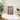 Harry Potter themed LEGO minifigures displayed in wooden frame on white table with plants