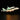 LEGO NASA space shuttle Enterprise attached to white carrier aircraft with illuminated lights on black background