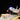 Illuminated LEGO model of NASA space shuttle Enterprise on white launch vehicle against black background