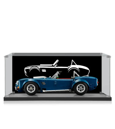 Blue classic convertible car model displayed in clear showcase with black backdrop and white car silhouette