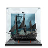 Black pirate ship model with sails and Jolly Roger flag in clear display case with ocean background