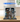 LEGO Arkham Asylum set 76300 displayed in clear protective case on wooden surface with minifigures