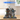 Lego Arkham Asylum model set 76300 displayed in clear protective case on wooden surface