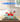 LEGO Lilo and Stitch Beach House set 43268 displayed in clear protective case on wooden table