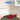 Red LEGO Ferrari FXX K model displayed in a clear acrylic display case on wood surface