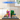 LEGO 75691 Glinda & Elphaba bookends displayed in a clear protective case on a wooden table