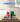 LEGO 75691 Glinda & Elphaba bookends displayed in a clear protective case on a wooden table