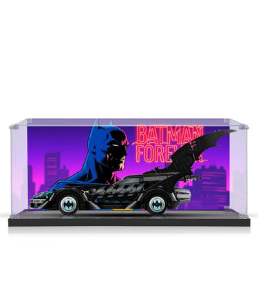 Lego Batman Forever Batmobile model in acrylic display case with neon cityscape backdrop