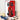 Red LEGO Ferrari F1 car model displayed against a red-white background poster, with blue and white LEGO classic cars