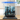 Black LEGO pirate ship model for set 10365 displayed in clear acrylic case on wooden table