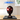 LEGO Marvel Miles Morales' Mask set 76329 displayed in a clear protective case on a wooden table