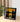 Framed art featuring a yellow Lego Porsche 911 GT3 RS model on a black and yellow background, displayed on a wooden table