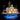 Illuminated detailed LEGO riverboat model on blue-lit stand with smokestacks and paddlewheel