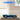 Lego Shelby Cobra 427 S/C model car in blue displayed in clear acrylic case on wooden table