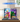 LEGO 75691 Glinda and Elphaba bookends display with pink and green books, minifigures, and themed background