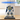 LEGO Transformers Soundwave 10358 model showcased inside clear display case on wooden table
