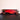 Red Ferrari SF-90 F1 model car with Shell and HP logos on black reflective surface and red background