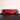 Red Ferrari SF-90 F1 model car with Shell and HP logos on black reflective surface and red background