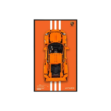 Top view of an orange LEGO Porsche GT3 RS model on an orange background with white racing stripes