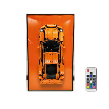 Orange LEGO-style sports car model mounted in black frame with included RF wireless remote control