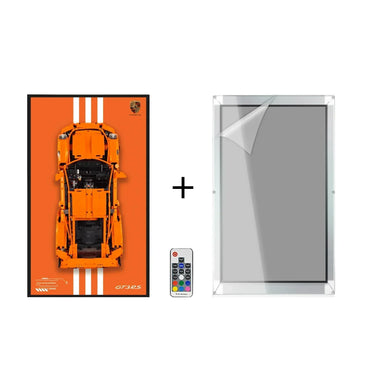 Orange LEGO Porsche GT3 RS model on display board with remote and acrylic frame protector