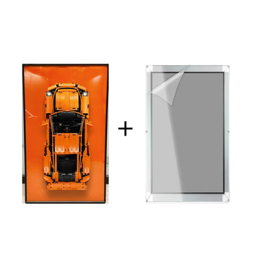 Orange toy car model in black frame with protective clear acrylic cover on white background