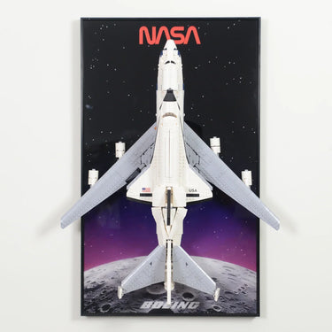 Top view of NASA space shuttle LEGO model with USA flag on wings against a space and moon backdrop