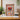 Framed Dungeons & Dragons collectible LEGO minifigures display with dragon centerpiece on wooden table