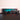 LEGO model of Mercedes AMG Petronas F1 car displayed on black surface with branded backdrop