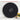 Back of round black wall clock showing battery compartment and mounting hole