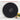 Back of round black wall clock showing battery compartment and mounting hole