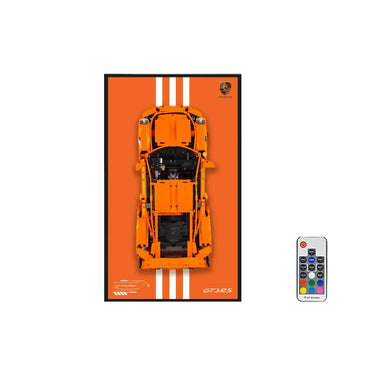 Orange LEGO Porsche GT3 RS car model on orange background with remote control, racing stripes