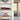 Modern home interior with wooden shelves displaying red Formula 1 car and LEGO beach house models