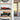 Shelf with red Formula 1 car model and vintage green car model in clear display cases in bright modern room
