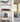 Modern shelves with a LEGO red race car and a LEGO Gotham Arkham building display in clear cases near a glass door