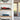 Modern interior shelves displaying red Formula 1 model car and blue vintage convertible model car in clear cases