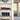 Modern shelf displaying detailed red Formula 1 model and blue vintage convertible model cars in clear cases
